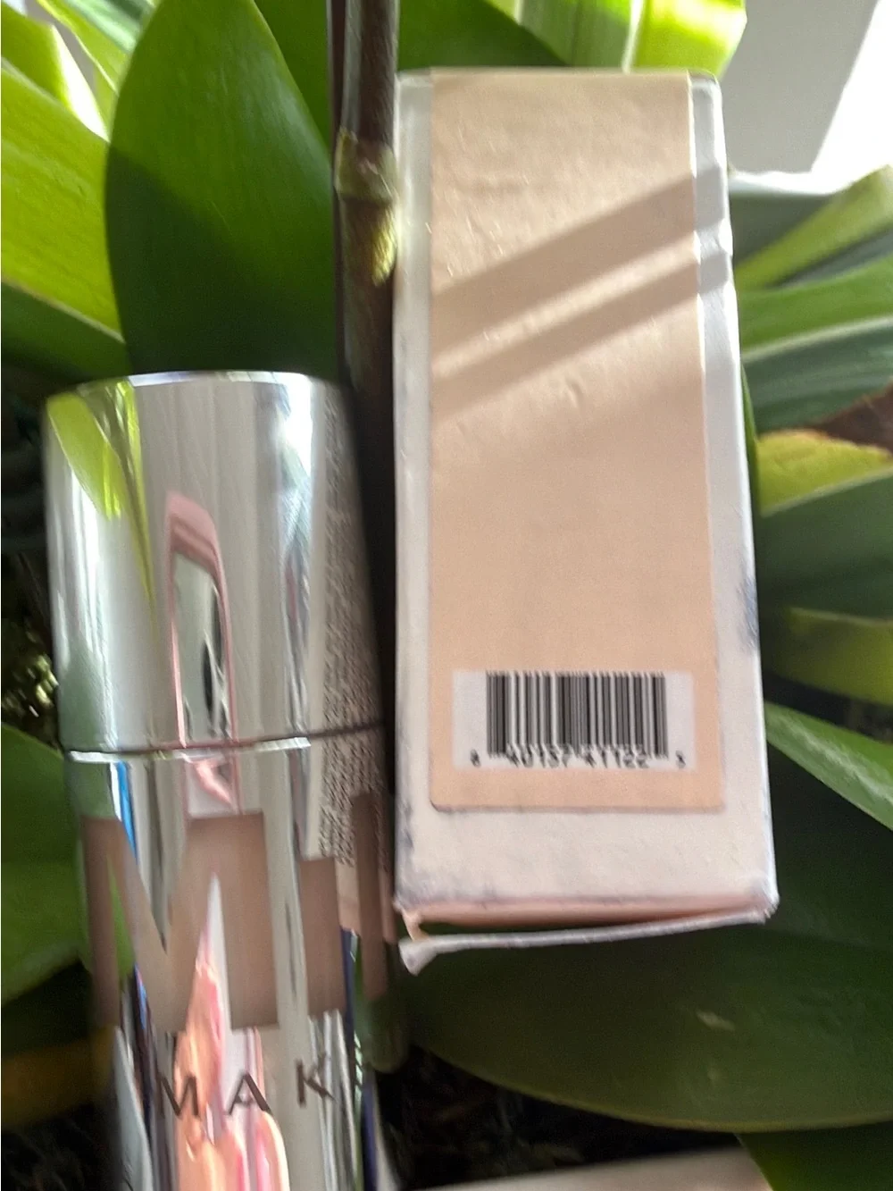 Milk Makeup Primer Stick in Shiny Silver Case with Soft Pink Box